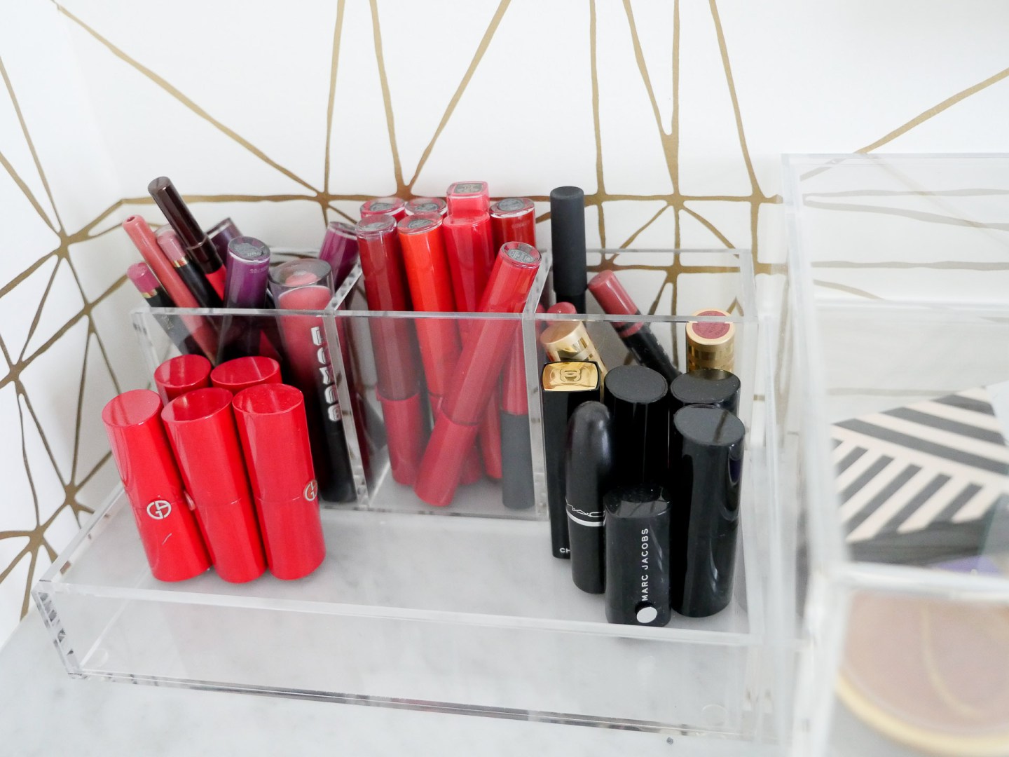 lipsticks are organized in an acryclic makeup holder in Eva Amurri Martino's connecticut glam room