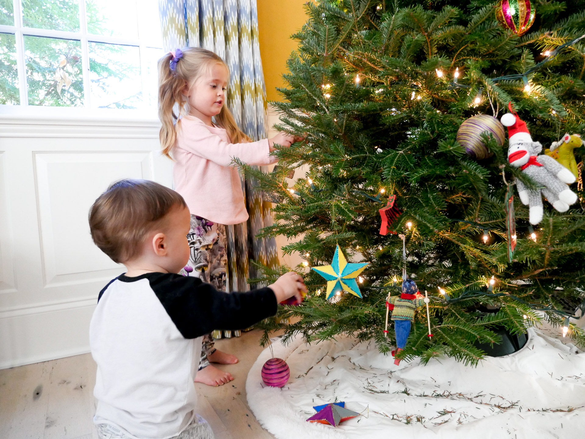 Marlowe and Major Martino decorate their family christmas tree in Connecticut the day after Thanksgiving as a Christmas tradition for kids