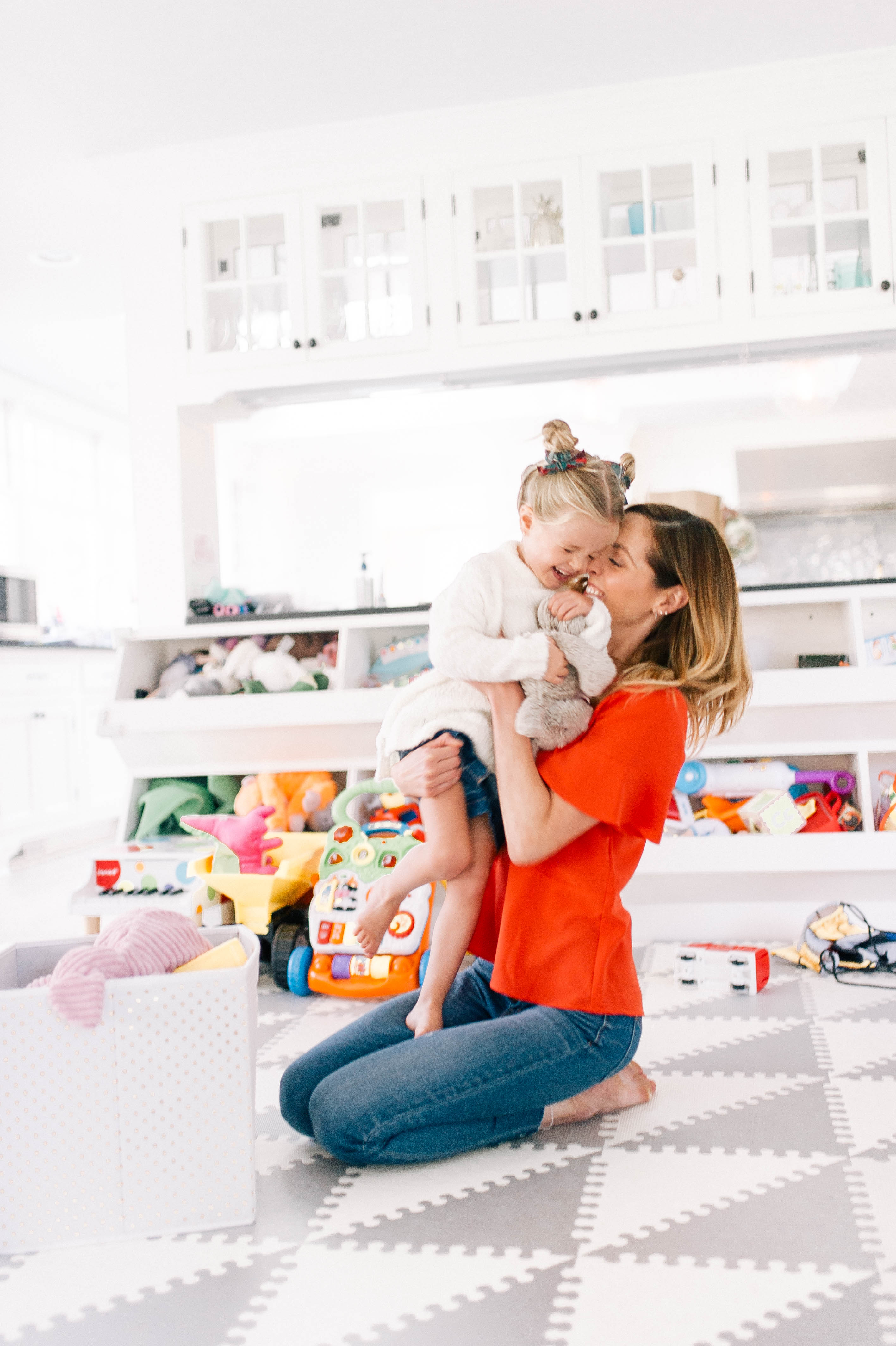 Eva Amurri hugs and tickles three year old daughter Marlowe in the family room of their Connecticut home