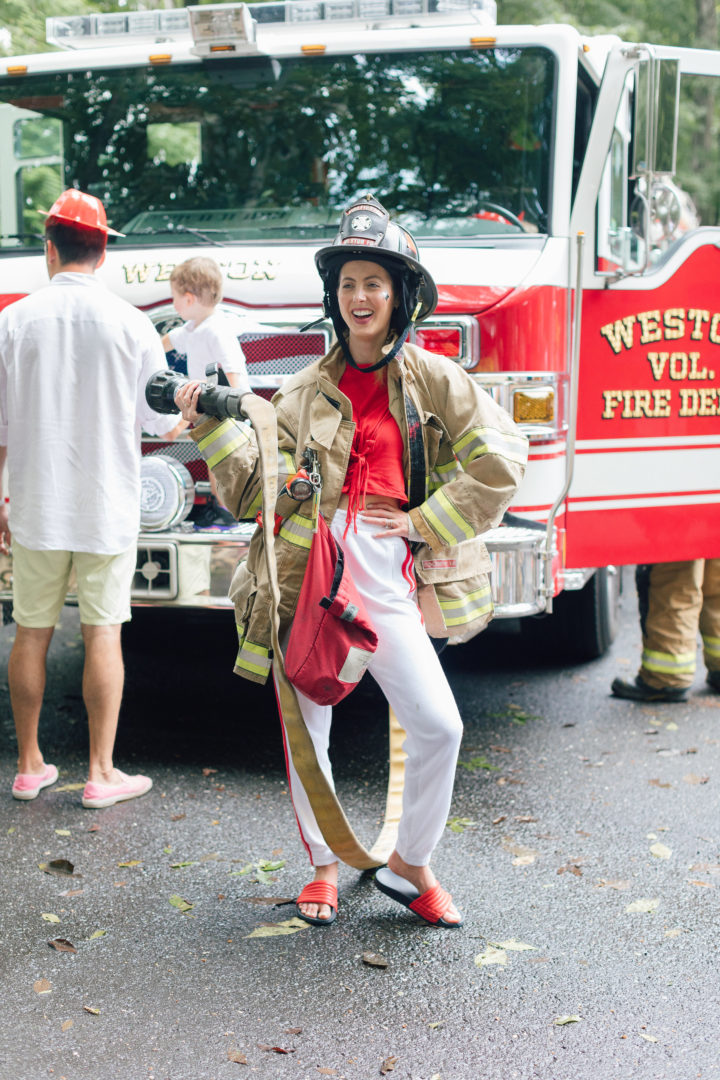 Eva Amurri Martino poses in fireman gear at her daughter Marlowe's 4th birthday party