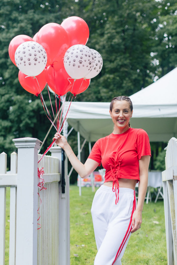 Eva Amurri Martino holds Red and white Dalmatian balloons at Marlowe Martino's 4th birthday