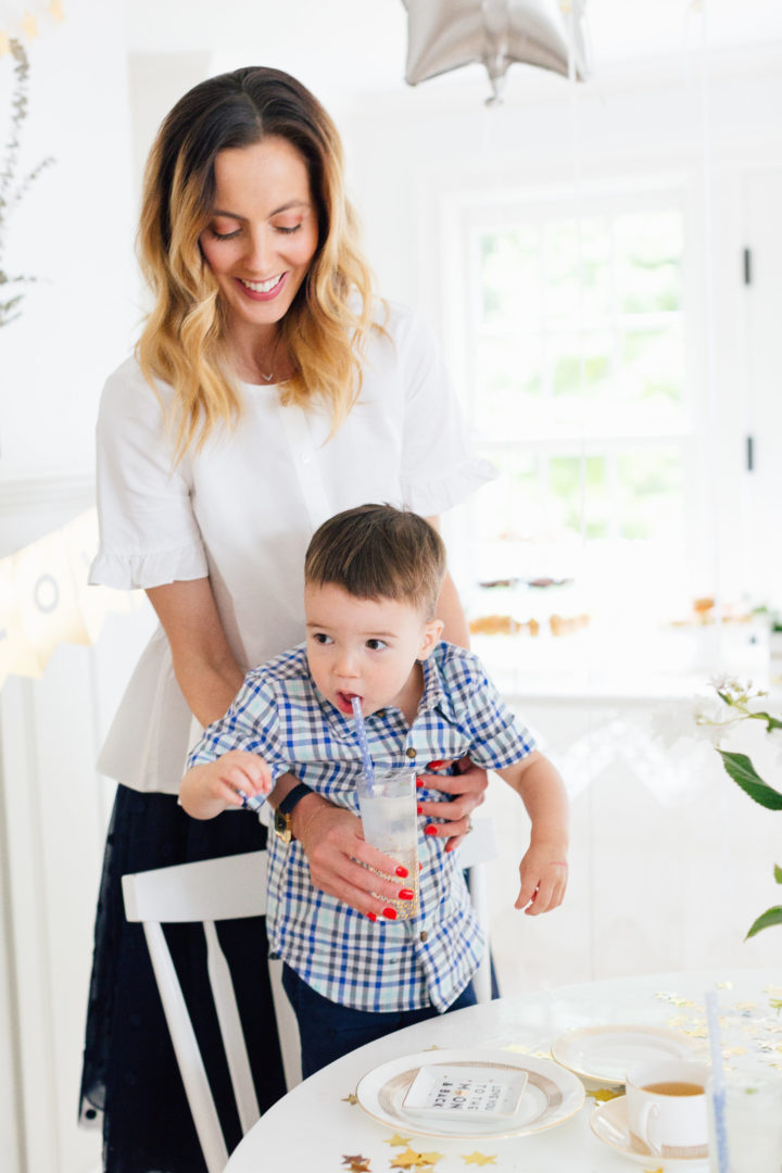 Eva Amurri Martino lifts up her son Major at her Eva Amurri Martino pours a cup of tea at her Celestial Baby Sprinkling Party