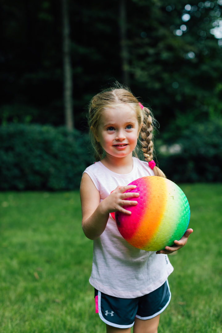 Eva Amurri Martino's daughter Marlowe plays with a ball in their backyard while her mom ponders commitment
