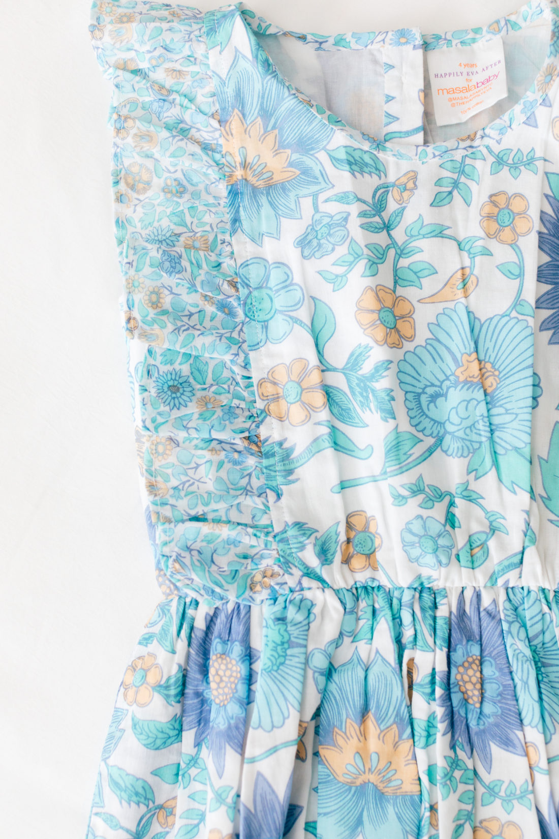 A close up of the detail on the fantasia dress from the Happily Eva After x Masala Baby capsule collection