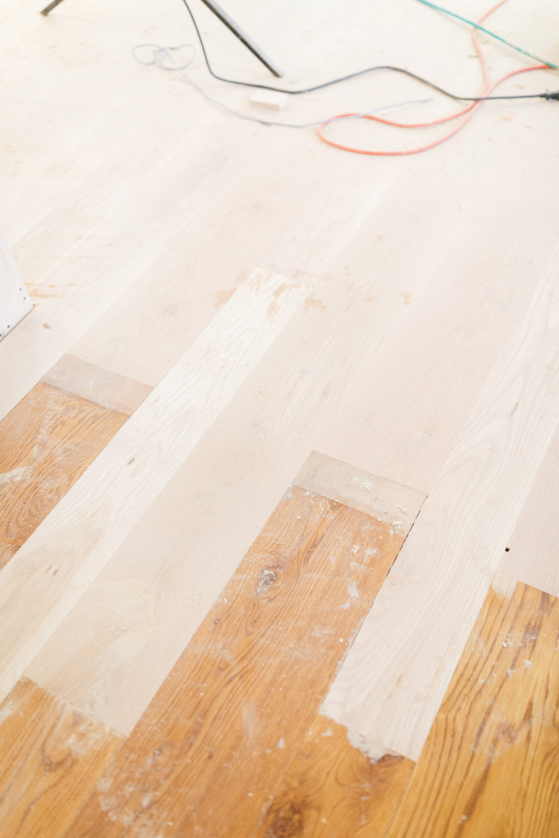 Eva Amurri Martino shows off the new stripped floors during her historic home renovation.