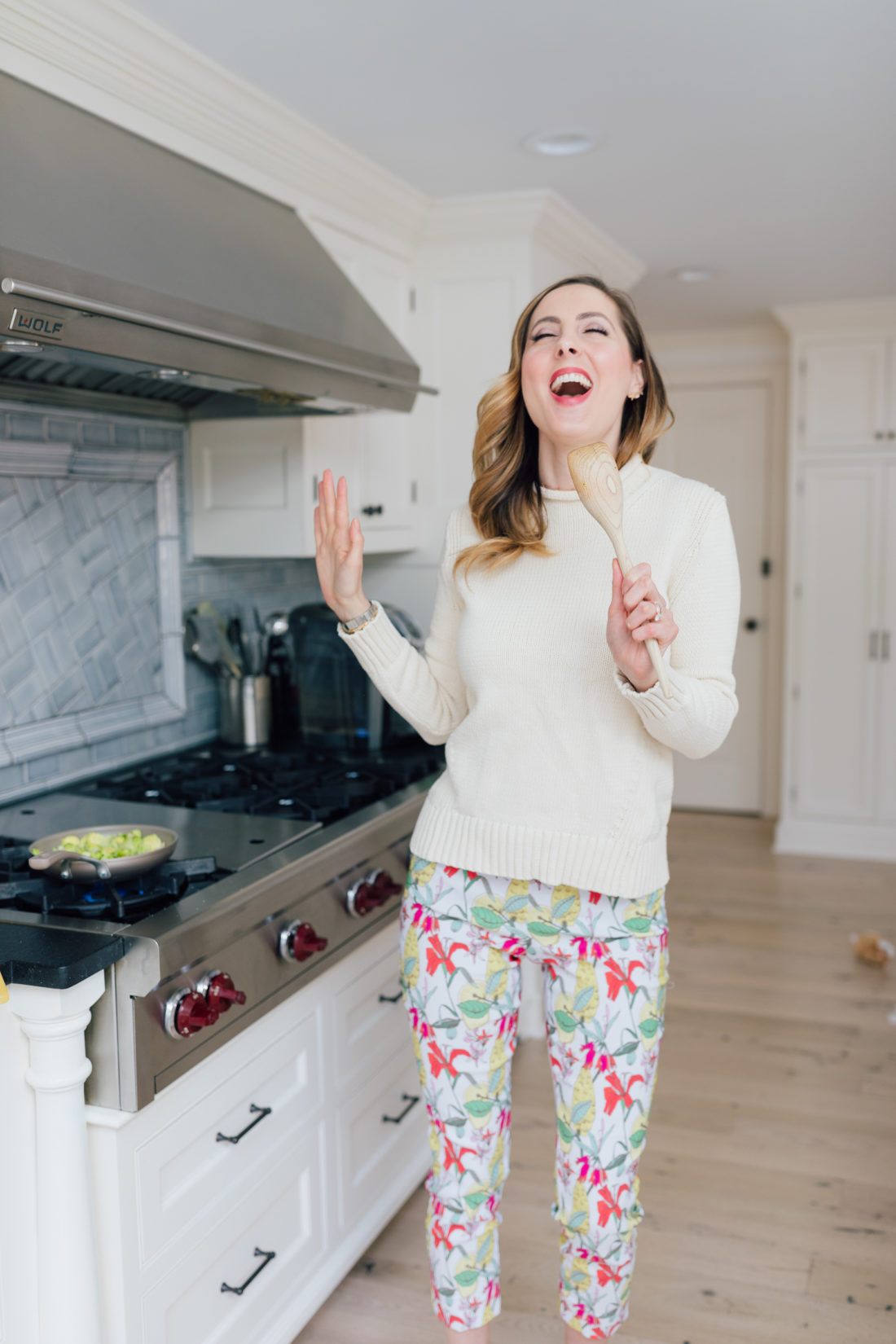 Eva Amurri Martino sautes onions for her Brussels Sprouts side dish