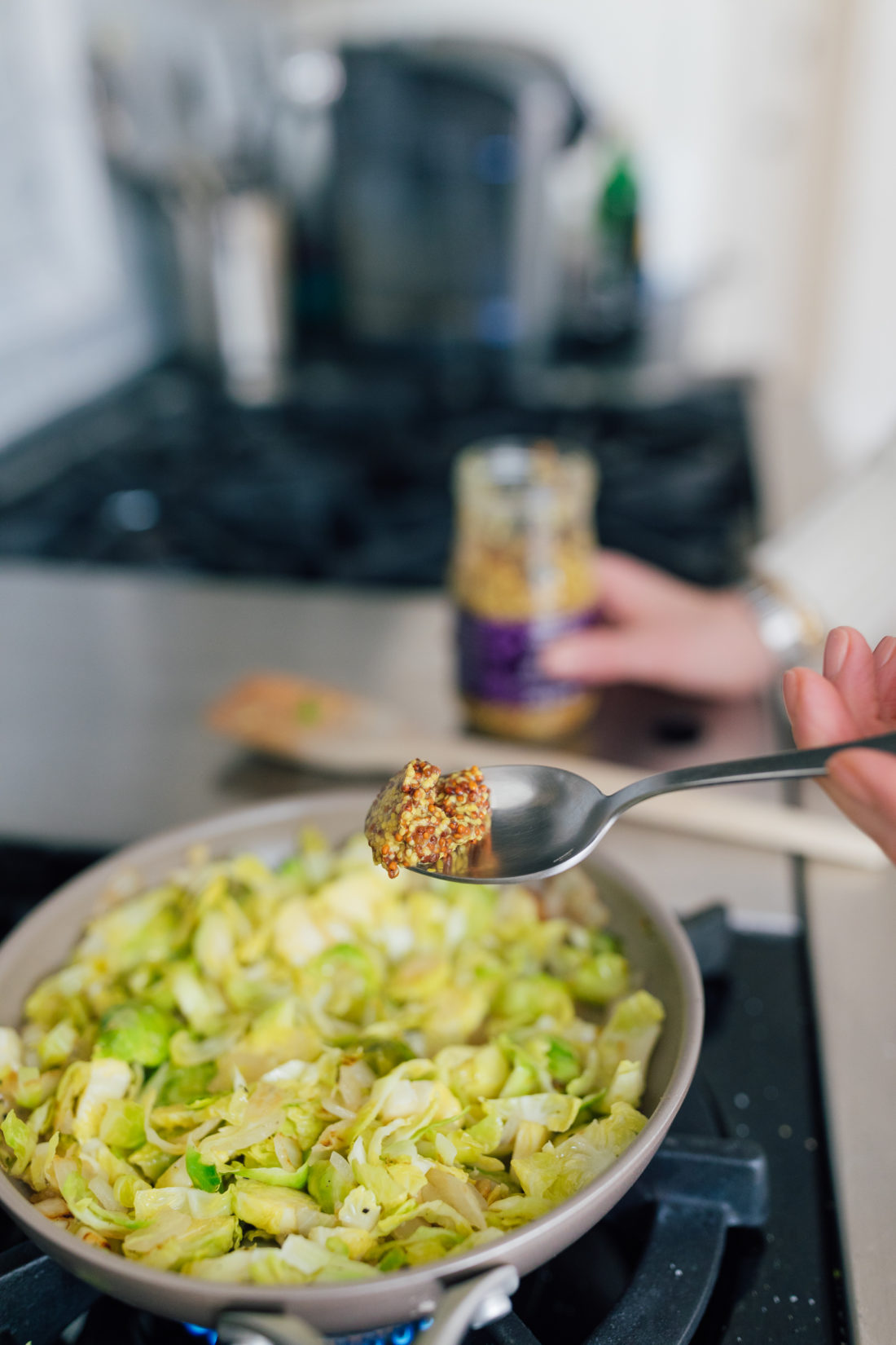 Eva Amurri Martino measures out grainy mustard for her Brussels Sprouts side dish