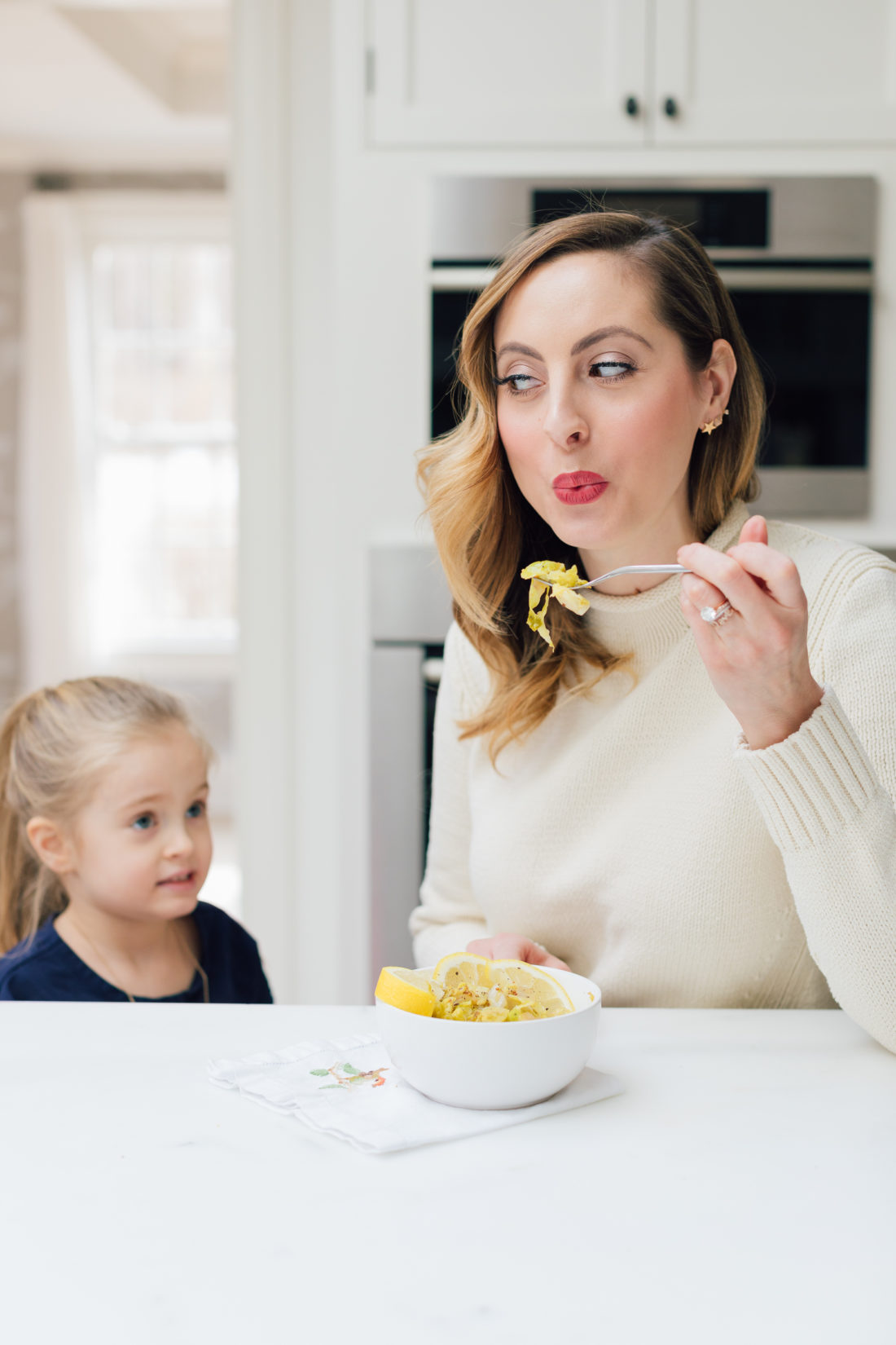 Eva Amurri Martino spoon feeds daughter Marlowe some of her brussels sprouts