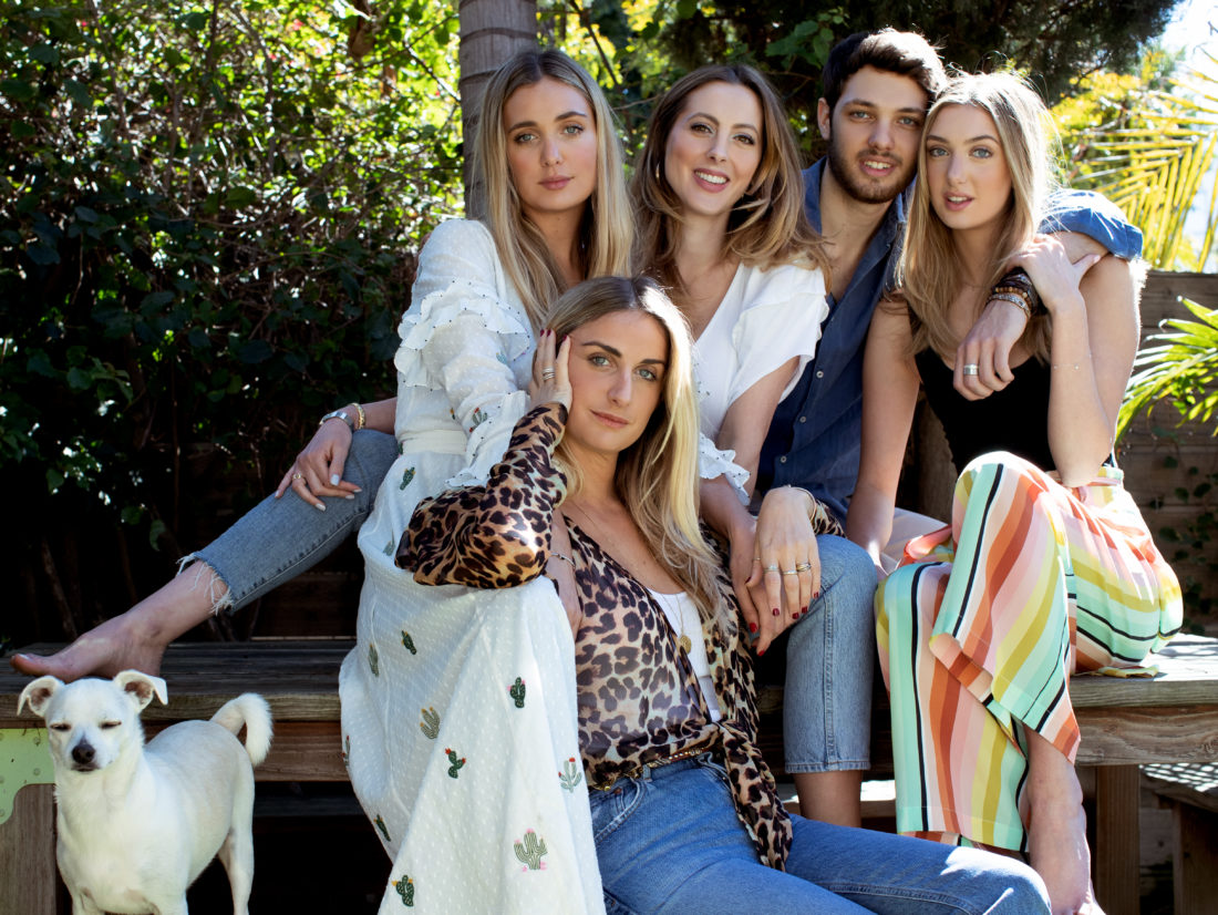 Eva Amurri Martino sits with her sisters and brother on a picnic table at a Venice bungalow