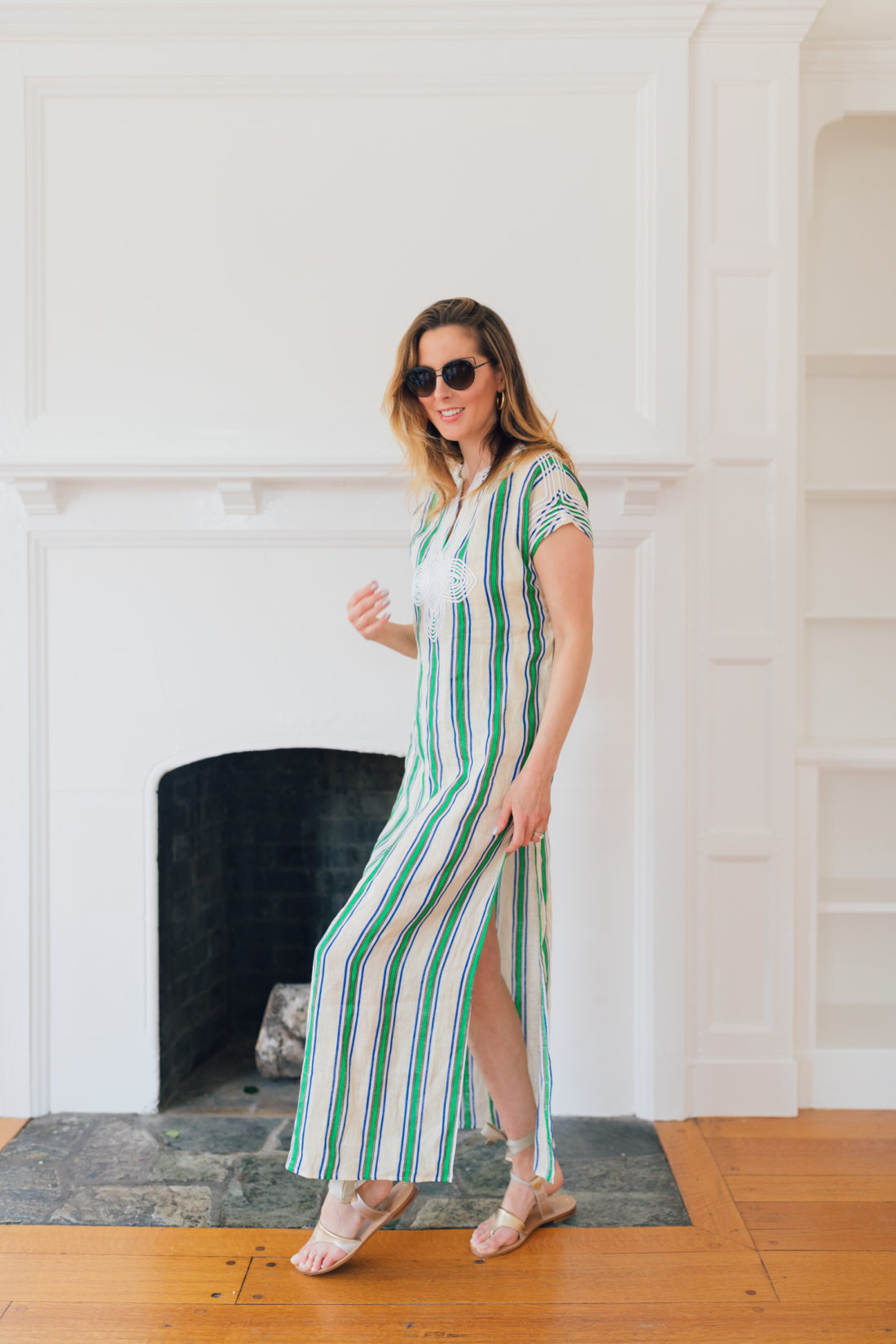 Eva Amurri Martino of Happily Eva After wears a green and white striped dress and shares her Jamaica packing list