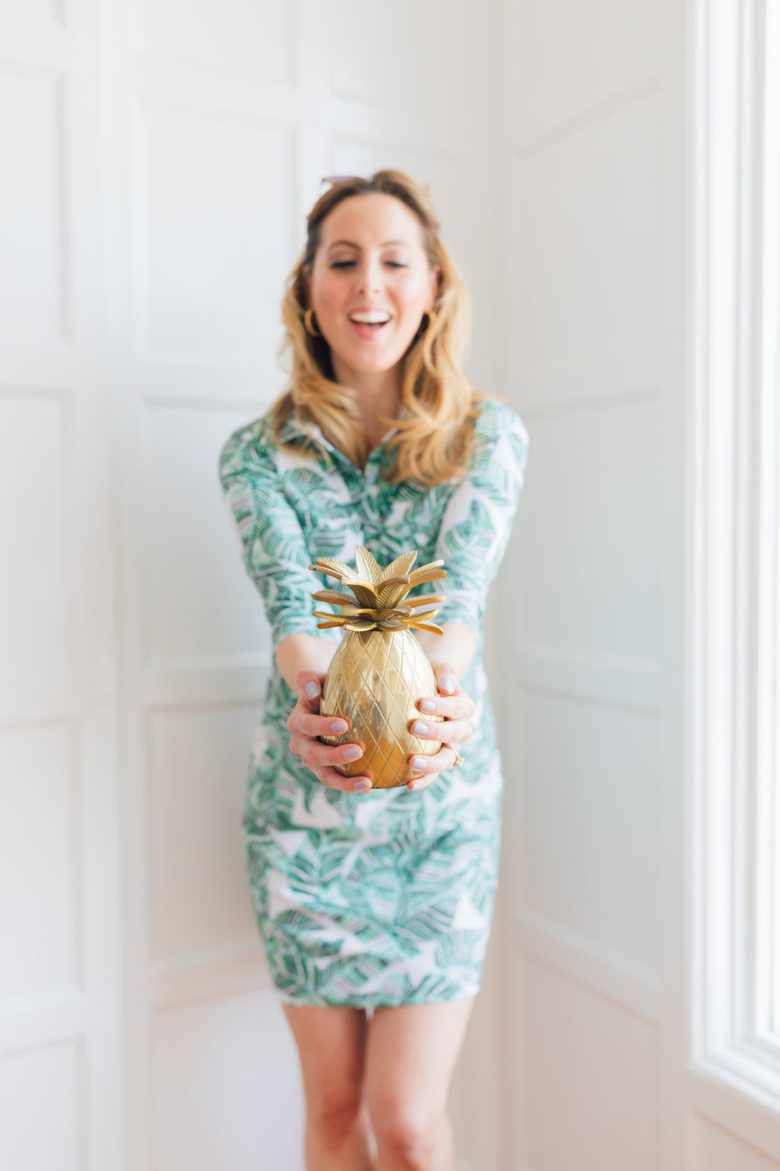 Eva Amurri Martino of Happily Eva After wears a green floral dress and shares her Jamaica packing list