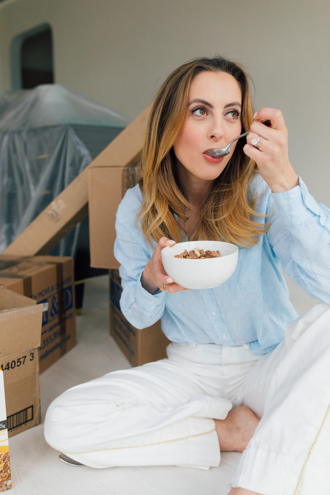 Eva Amurri Martino of Happily Eva After sits on the floor of her newly renovated historic home in Connecticut, enjoying a bowl of Special K