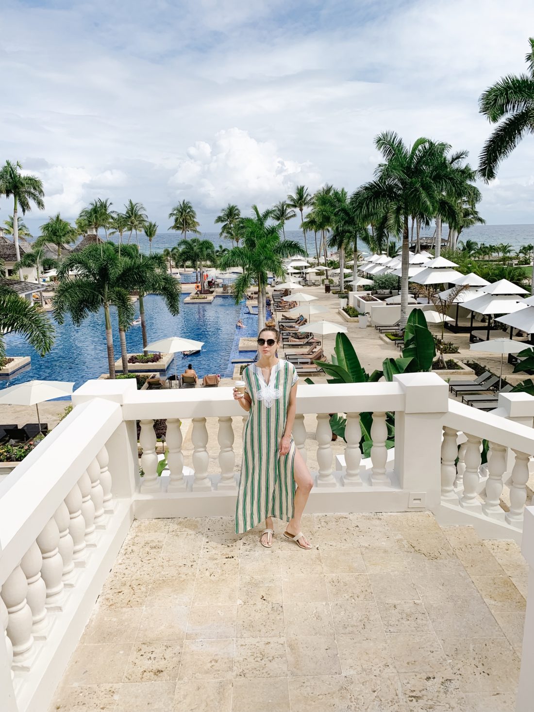 Eva Amurri Martino of Happily Eva After poses in a Tory Burch cover up on her family trip to Jamaica