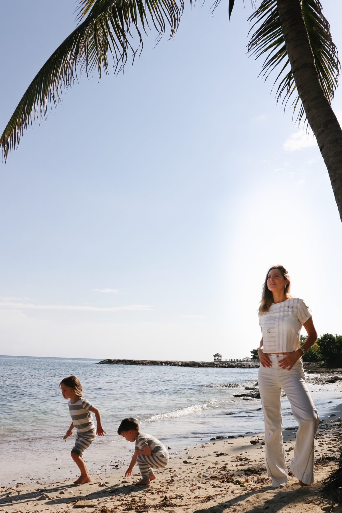 Eva Amurri Martino stands on the beach in Jamaica with her kids Marlowe and Major