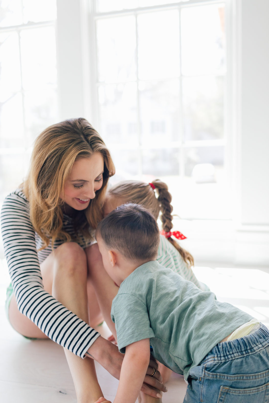 Eva Amurri Martino of Happily Eva After plays with her kids Marlowe and Major on the floor of their new home in Connecticut