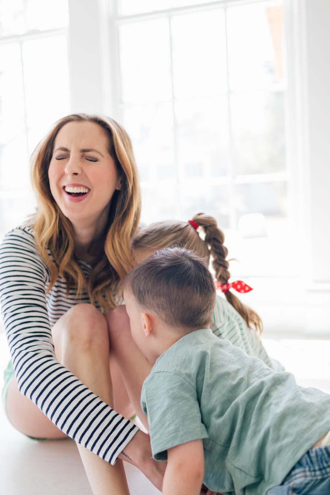 Eva Amurri Martino of Happily Eva After plays with her kids Marlowe and Major on the floor of their new home in Connecticut