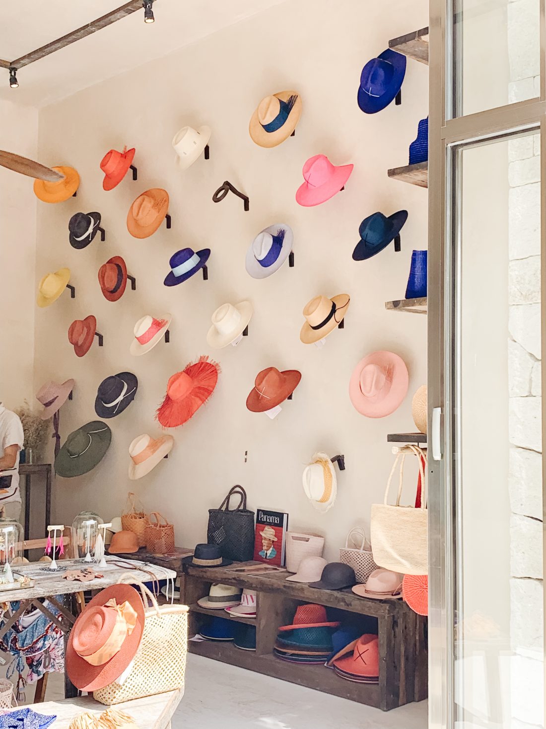 A Tulum boutique filled with colorful hats