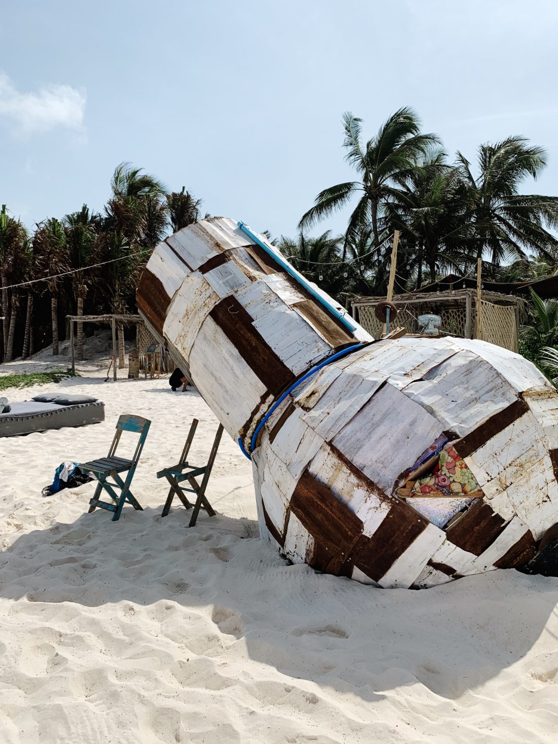 A wooden sculpture on the beach in Tulum Mexico