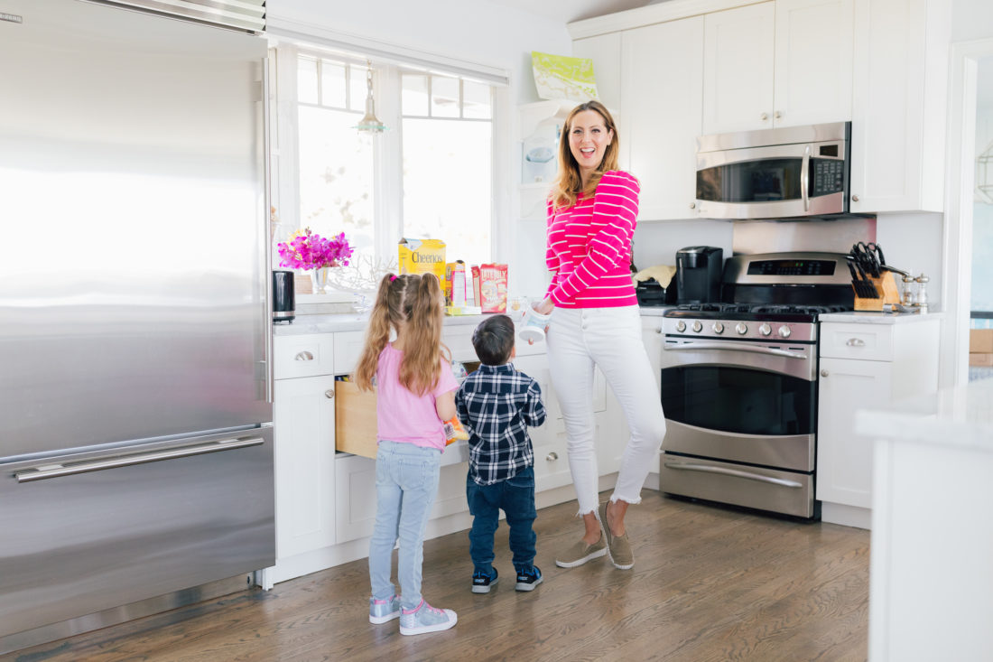 Eva Amurri Martino of Happily Eva After wears Sketchers wears Sepulvada Blvd a la Mode Slip-On in the kitchen with her kids Marlowe and Major