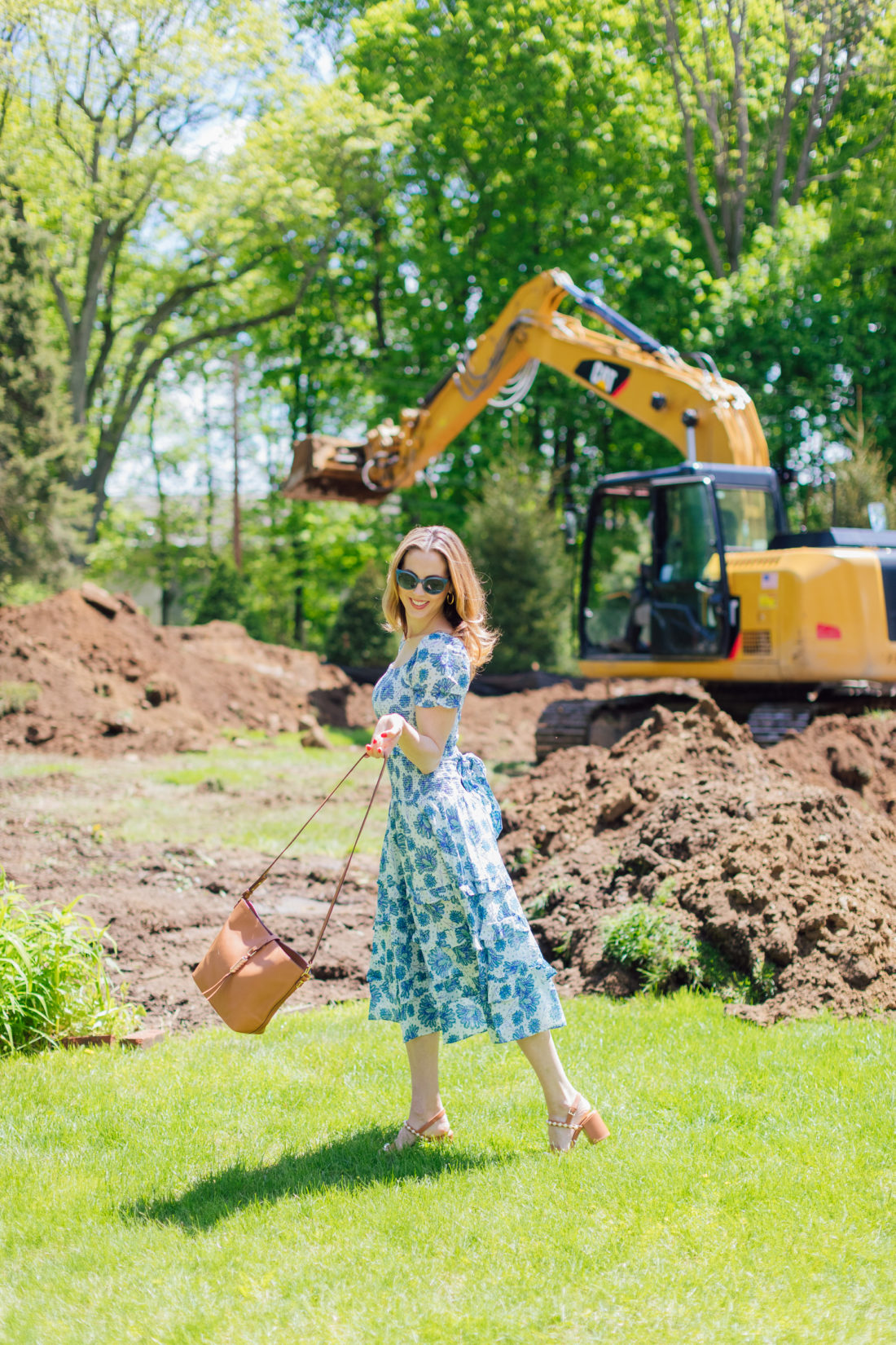 Eva Amurri Martino walks thorugh the construction in backyard of her home