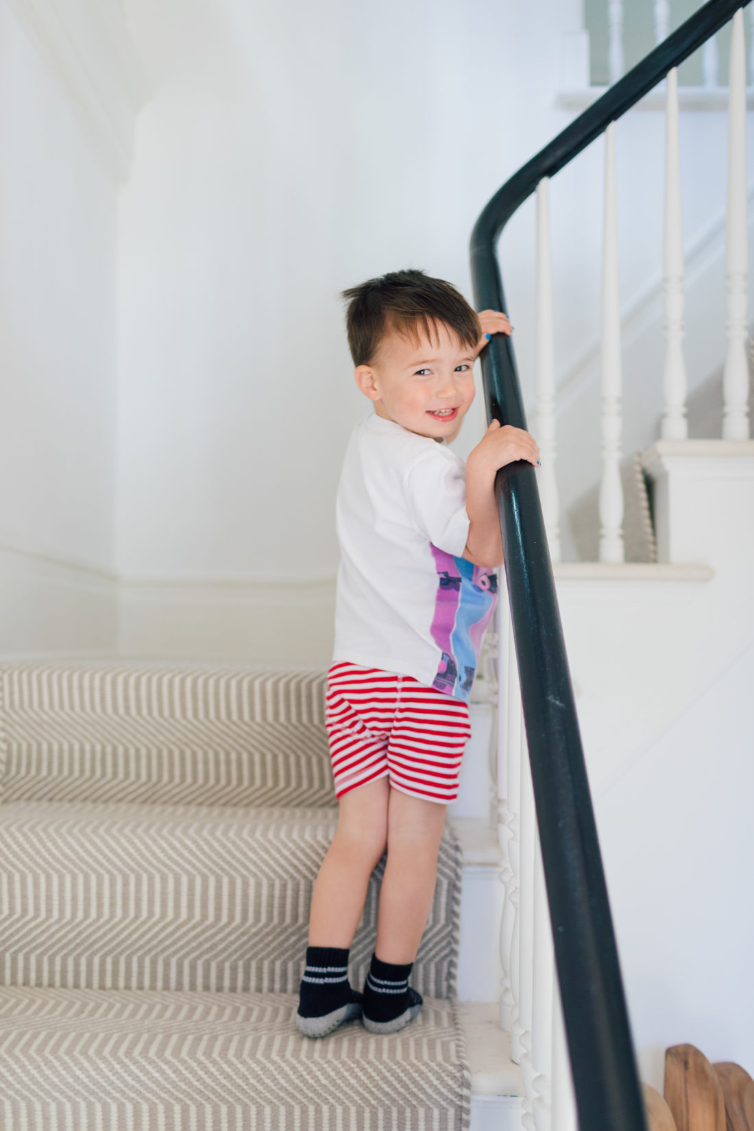 Major Martino turns to walk up the staircase in his connecticut home, wearing the big boy underwear he received at the start of potty training
