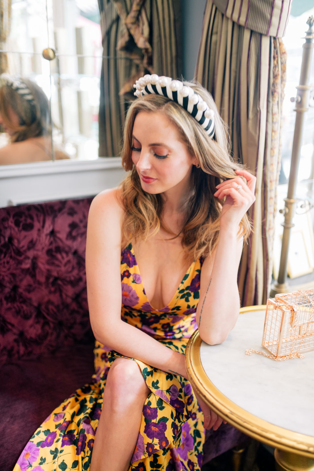 Eva Amurri Martino wears a bright flowery dress and a statement headband at Ladurée on the Upper East Side
