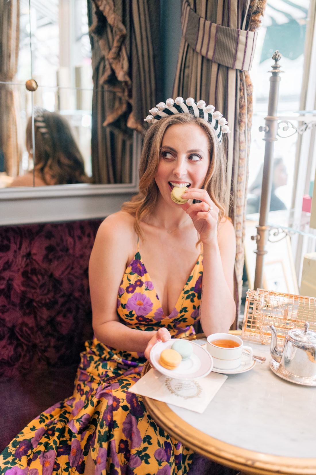 Eva Amurri Martino eats instagrammable food in NYC from Ladurée on the Upper East Side in a bright flowery dress and a headband.