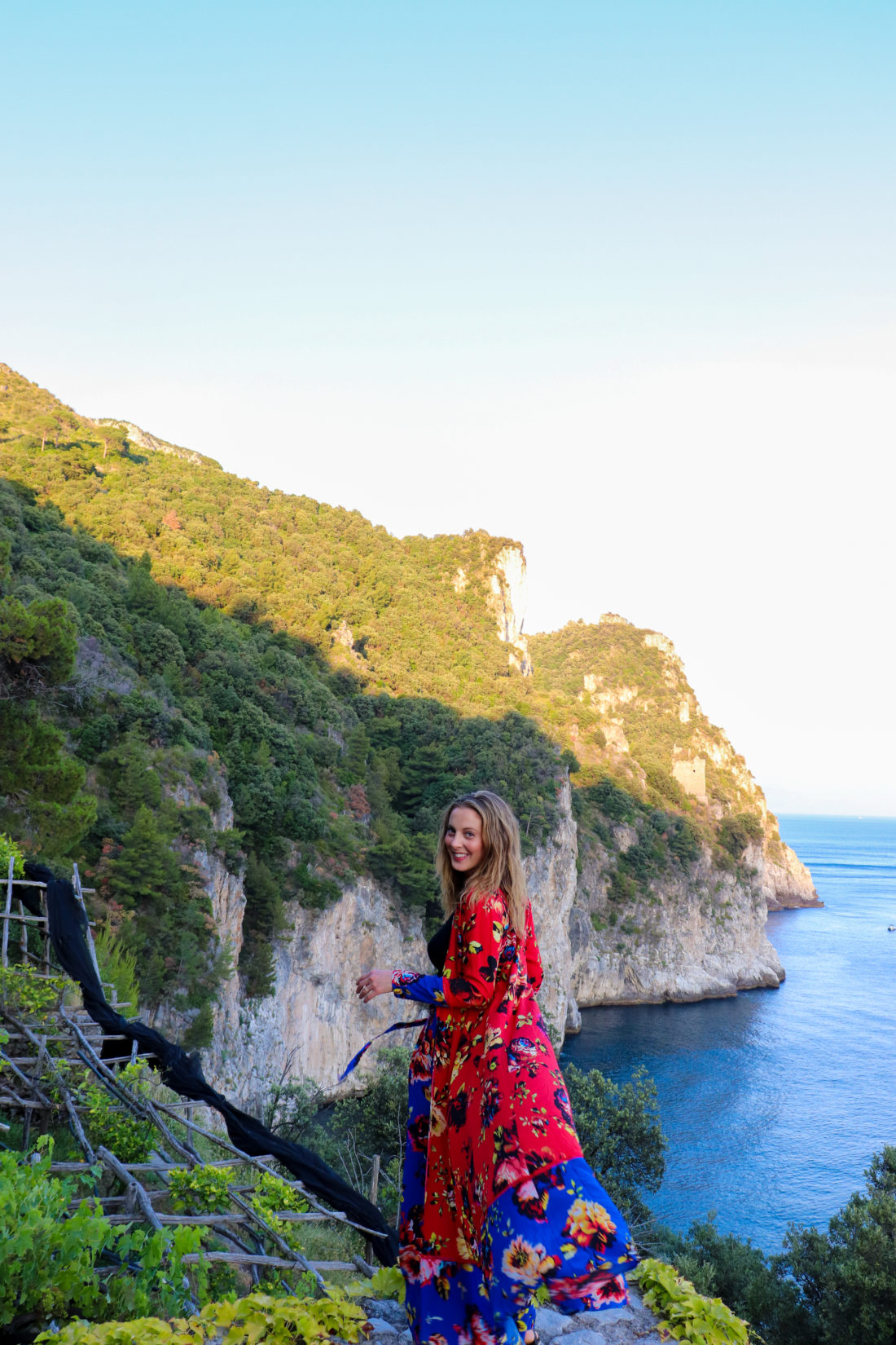 Eva Amurri Martino wears a colorful dress on the cliffs of Amalfi