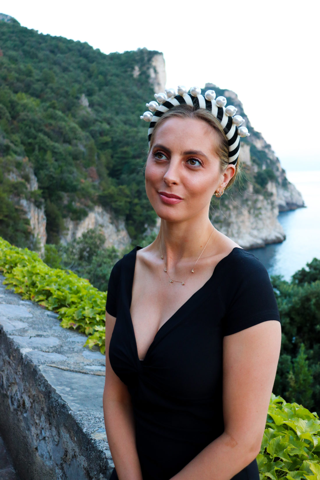 Eva Amurri Martino wears a pearl studded headband in the Amalfi Coast