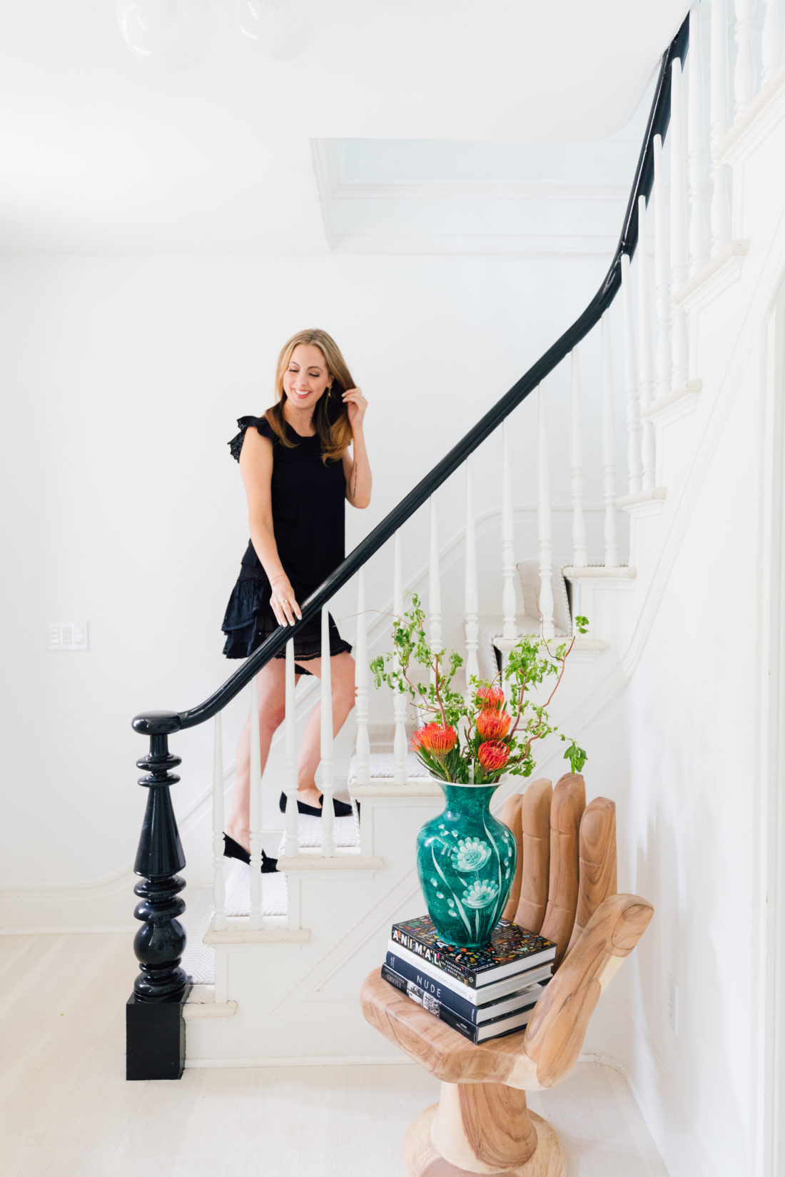 Eva Amurri Martino walks up the staircase of the entry way of her Connecticut home