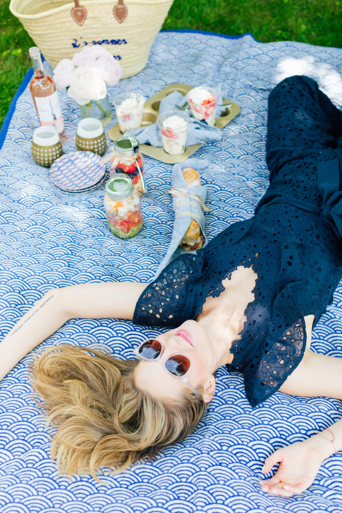 Eva Amurri Martino lies down on a picnic blanket