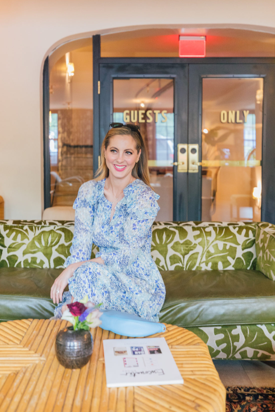 Eva Amurri Martino sits in a floral dress at Clermont Hotel